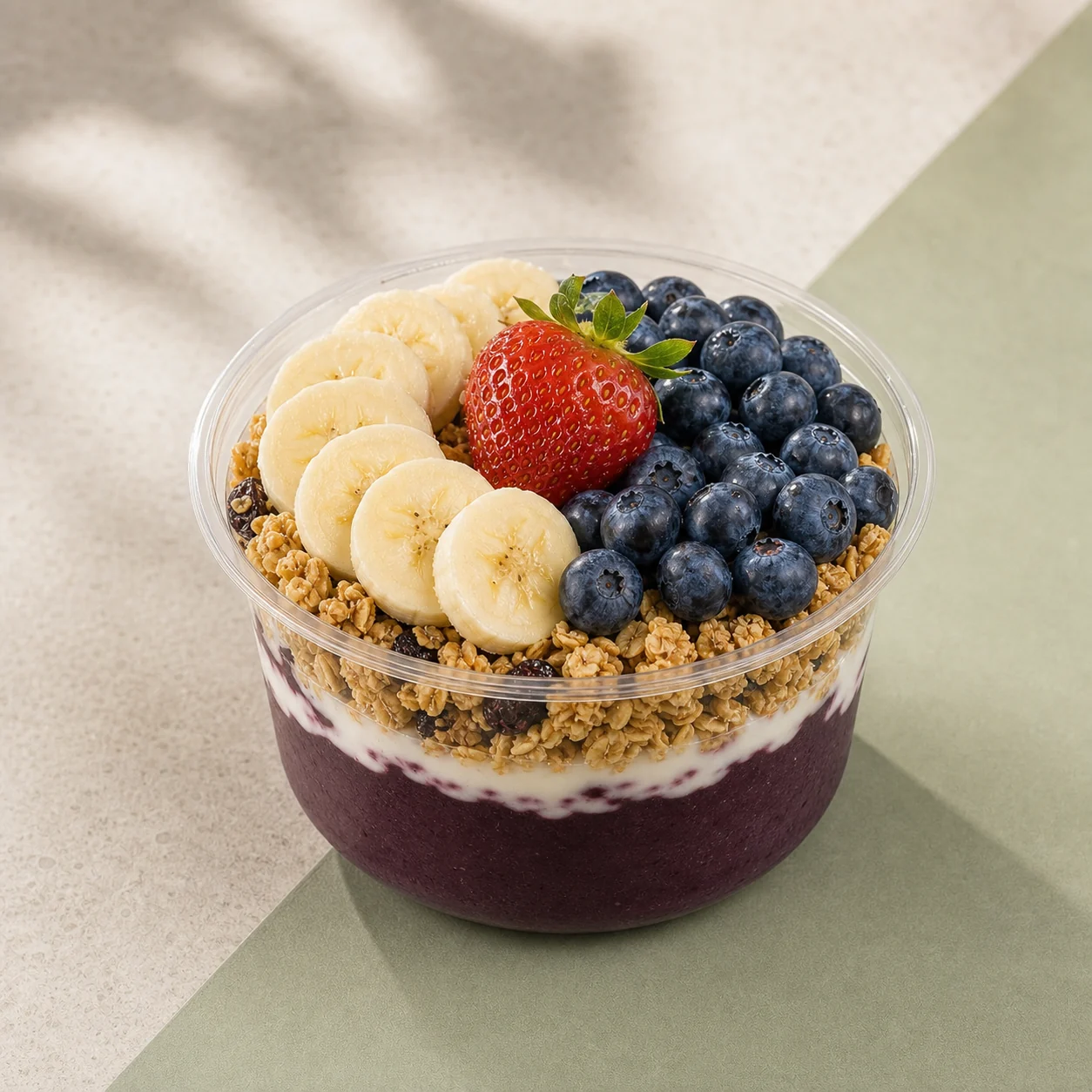 An açai bowl with banana, blueberries and strawberry